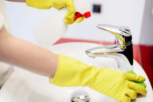 Technician performing hot water extraction carpet cleaning