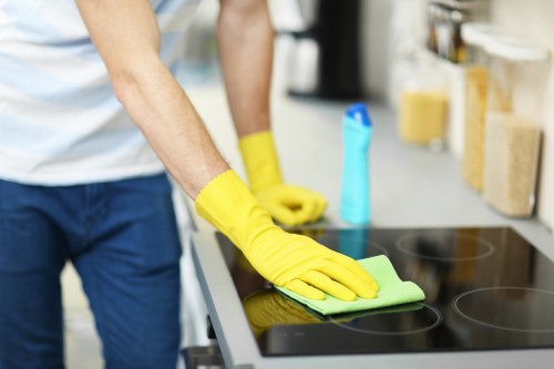 Team member following health and safety procedures during carpet cleaning